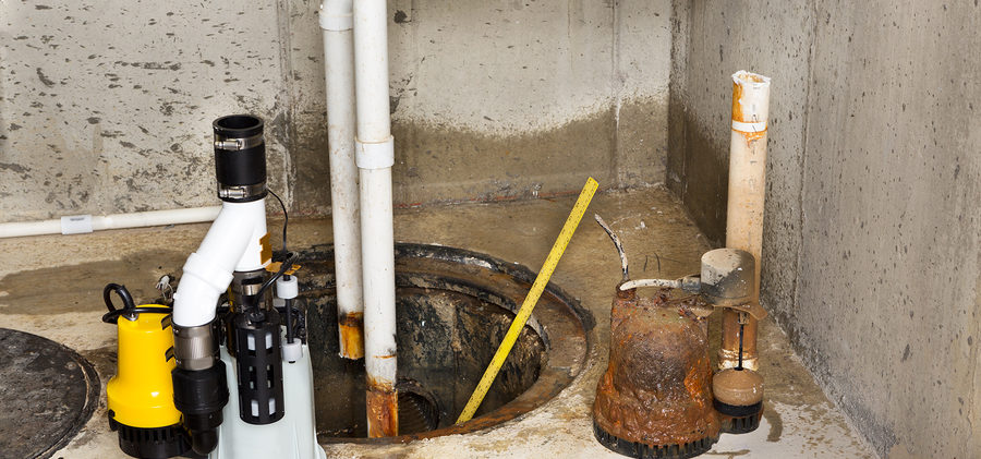 Replacing The Old Sump Pump In A Basement